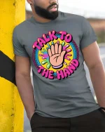 Talk To The Hand Funny Retro Colorful Graphic Tshirt - model wearing grey tee, leaning on column